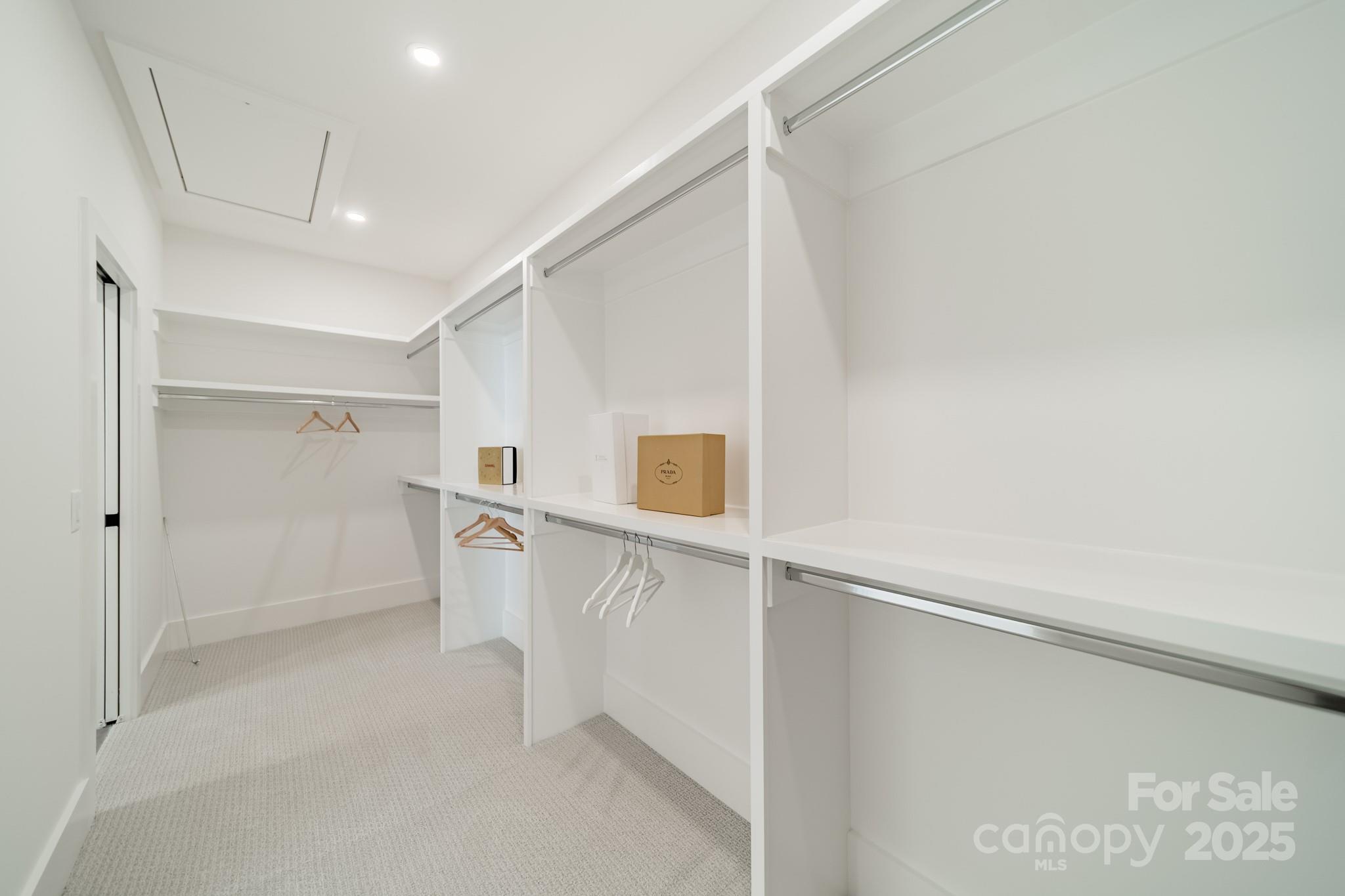 19032 Newburg Hill Road, Unit 23 Davidson, NC 28036 - Photo 21 of 39 a view of walk in closet with empty racks