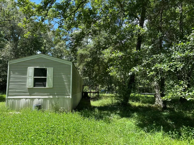 a backyard of a house with lots of green space