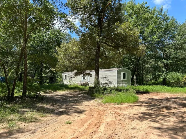 a view of a house with a street