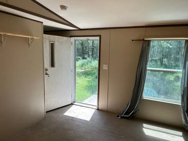 a view of a room with a large window