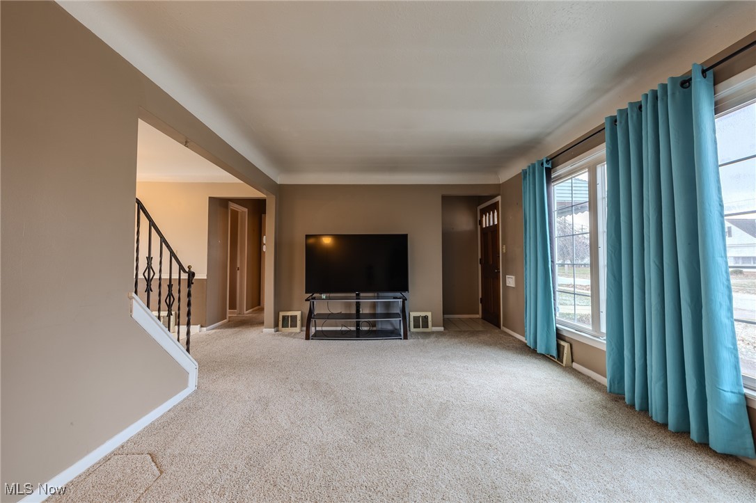 765 Pendley Road Willowick, OH 44095 - Photo 43 of 50 Unfurnished living room featuring carpet flooring