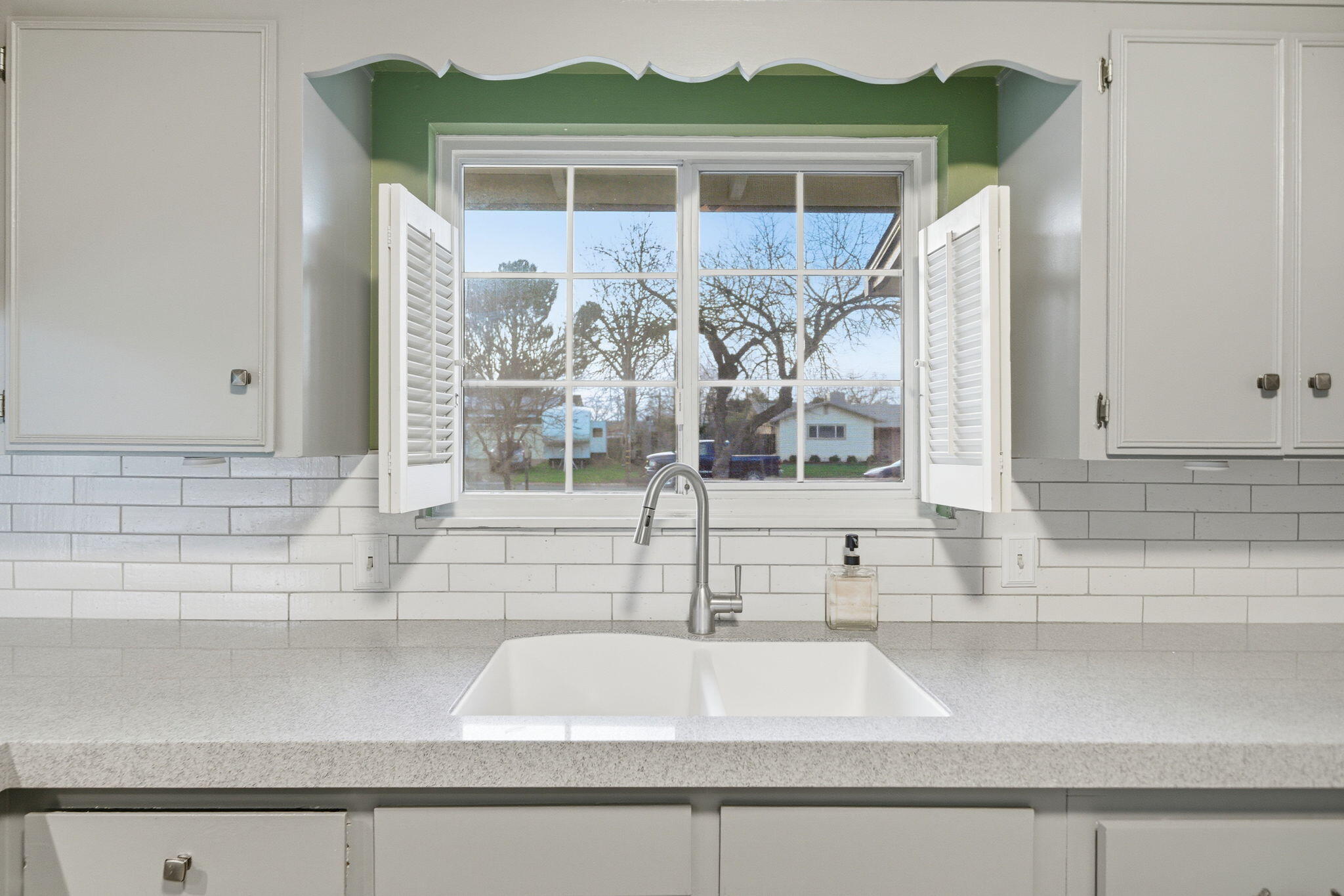 6927 Riata Drive Redding, CA 96002 - Photo 13 of 39 a view of a bathroom with a sink and a window
