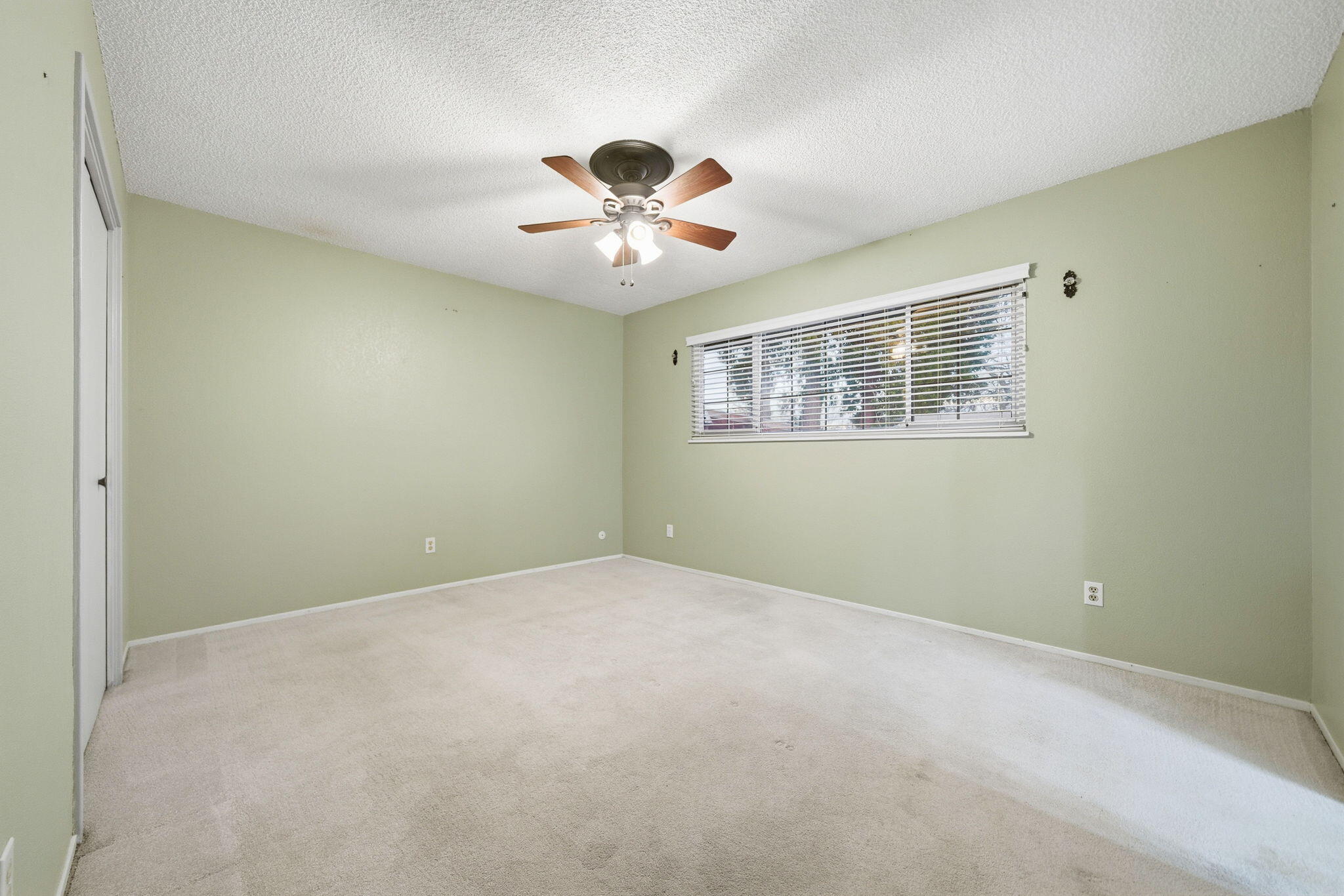 6927 Riata Drive Redding, CA 96002 - Photo 17 of 39 a view of an empty room with a window