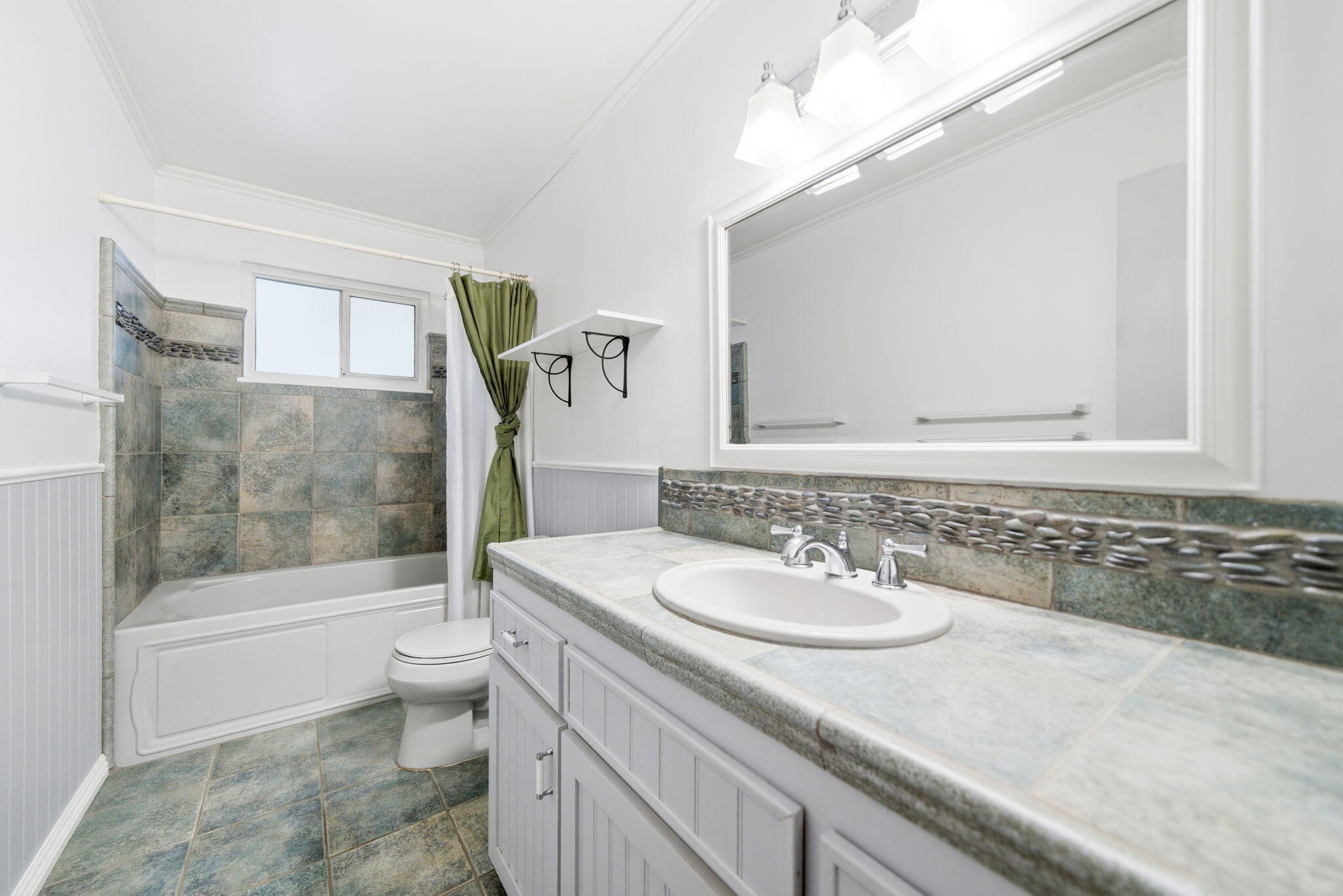 6927 Riata Drive Redding, CA 96002 - Photo 24 of 39 a bathroom with a sink a toilet and shower