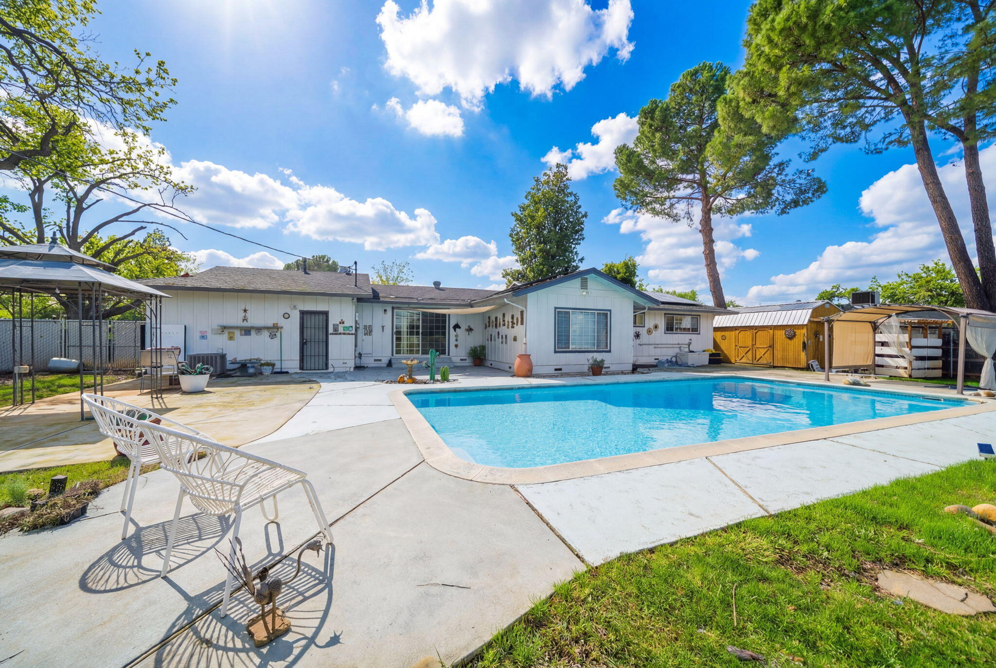 6927 Riata Drive Redding, CA 96002 - Photo 28 of 39 a view of a house with swimming pool and sitting area