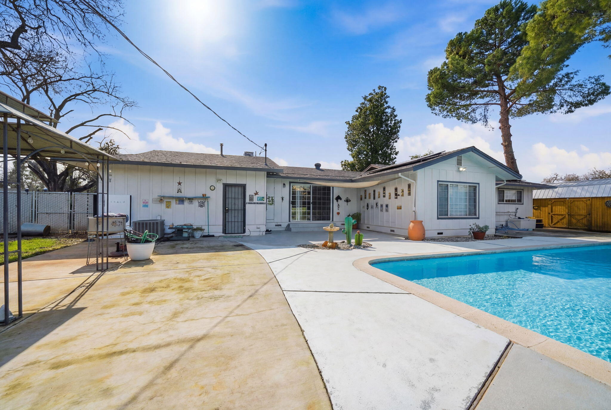 6927 Riata Drive Redding, CA 96002 - Photo 30 of 39 a view of a house with backyard and sitting area