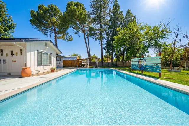 a view of a swimming pool with a patio