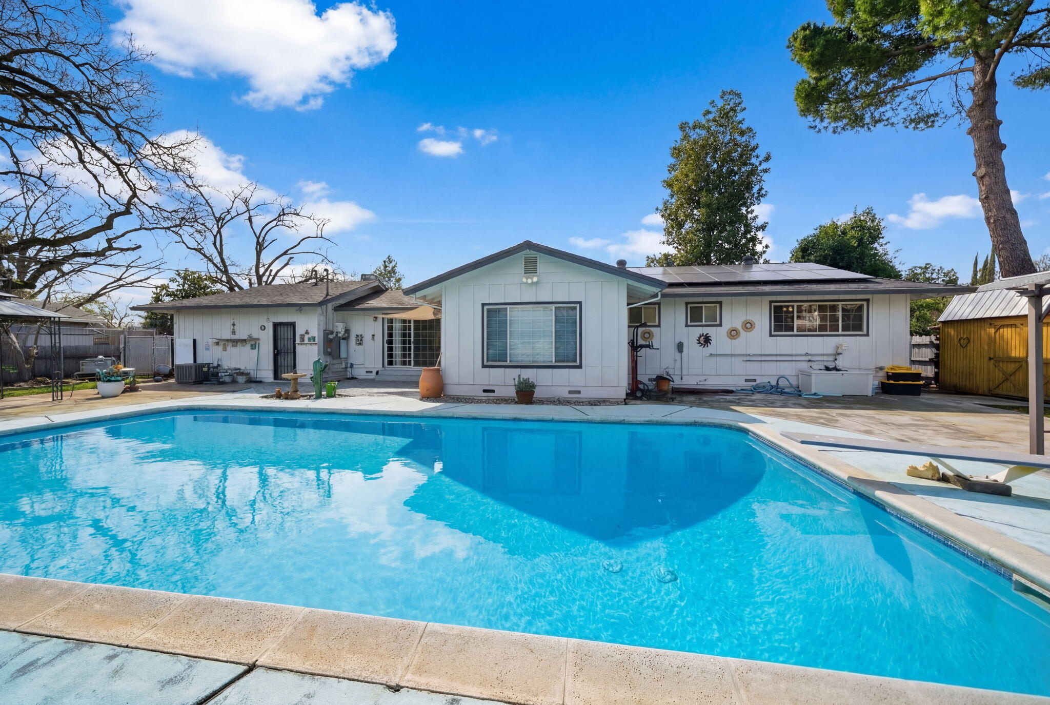 6927 Riata Drive Redding, CA 96002 - Photo 33 of 39 a view of a house with swimming pool