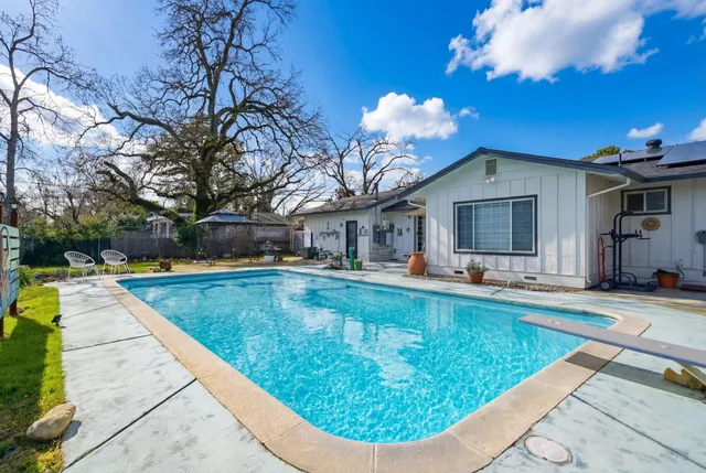 a view of a house with swimming pool