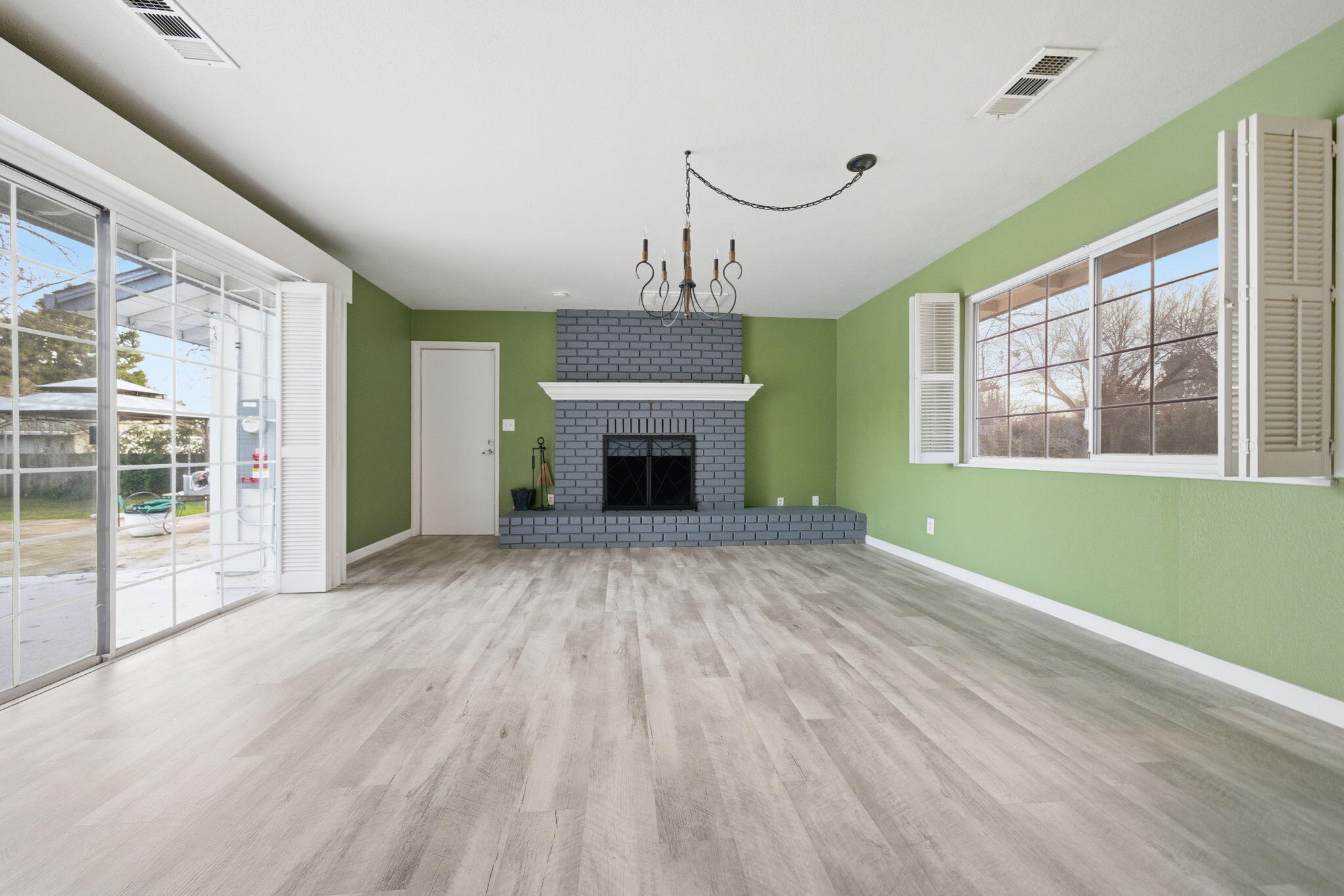 6927 Riata Drive Redding, CA 96002 - Photo 8 of 39 a view of an empty room with window fire place and an entryway