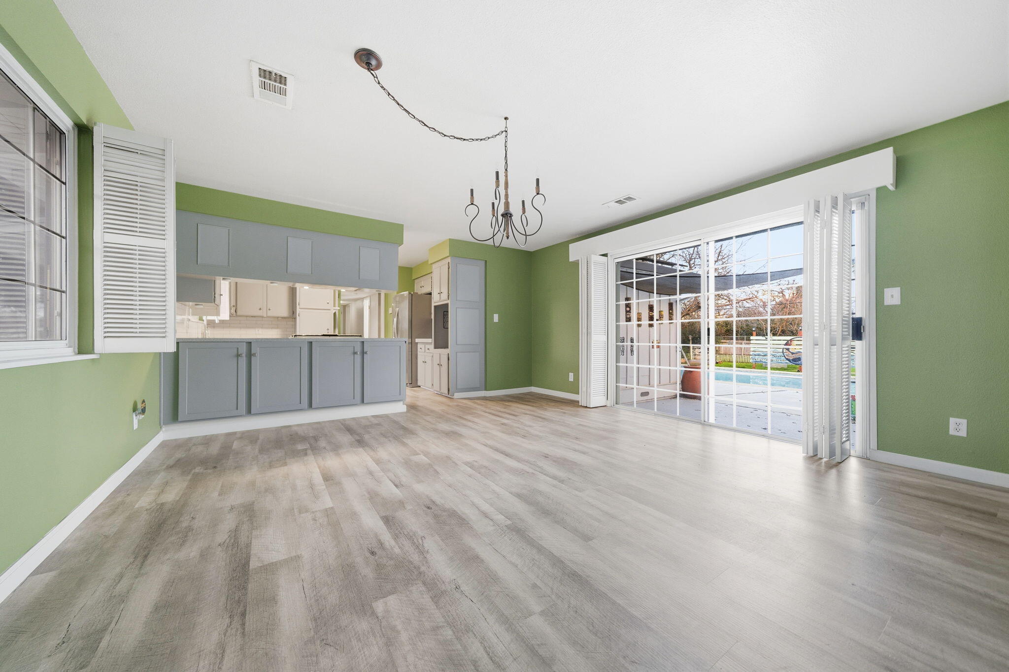 6927 Riata Drive Redding, CA 96002 - Photo 10 of 39 a view of an empty room with wooden floor and a window