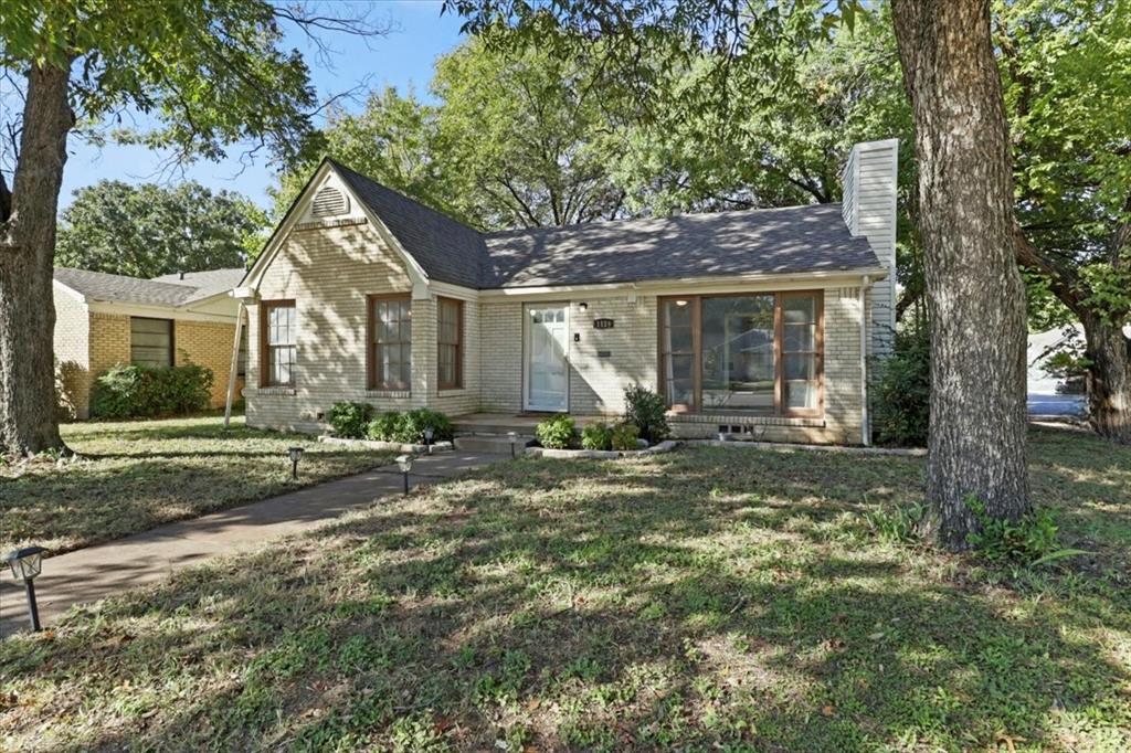 1129 North Riverside Drive Fort Worth, TX 76111 - Photo 1 of 29 front view of a house with a yard