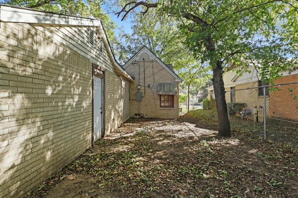 1129 North Riverside Drive Fort Worth, TX 76111 - Photo 29 of 29 a view of a house with a yard