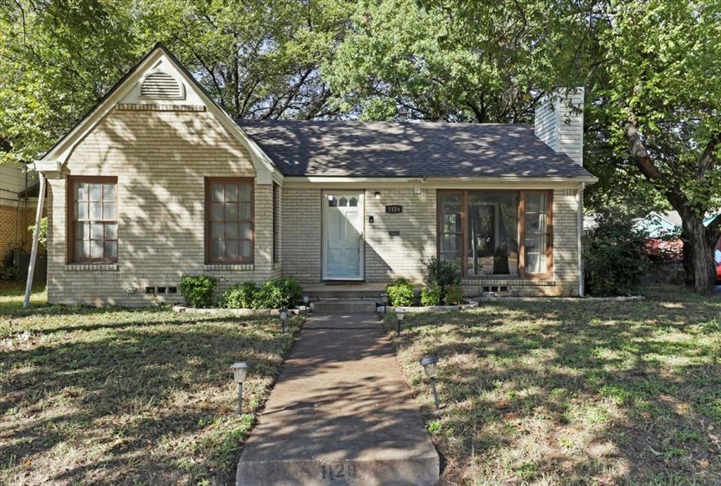 1129 North Riverside Drive Fort Worth, TX 76111 - Photo 4 of 29 a view of a house with a yard