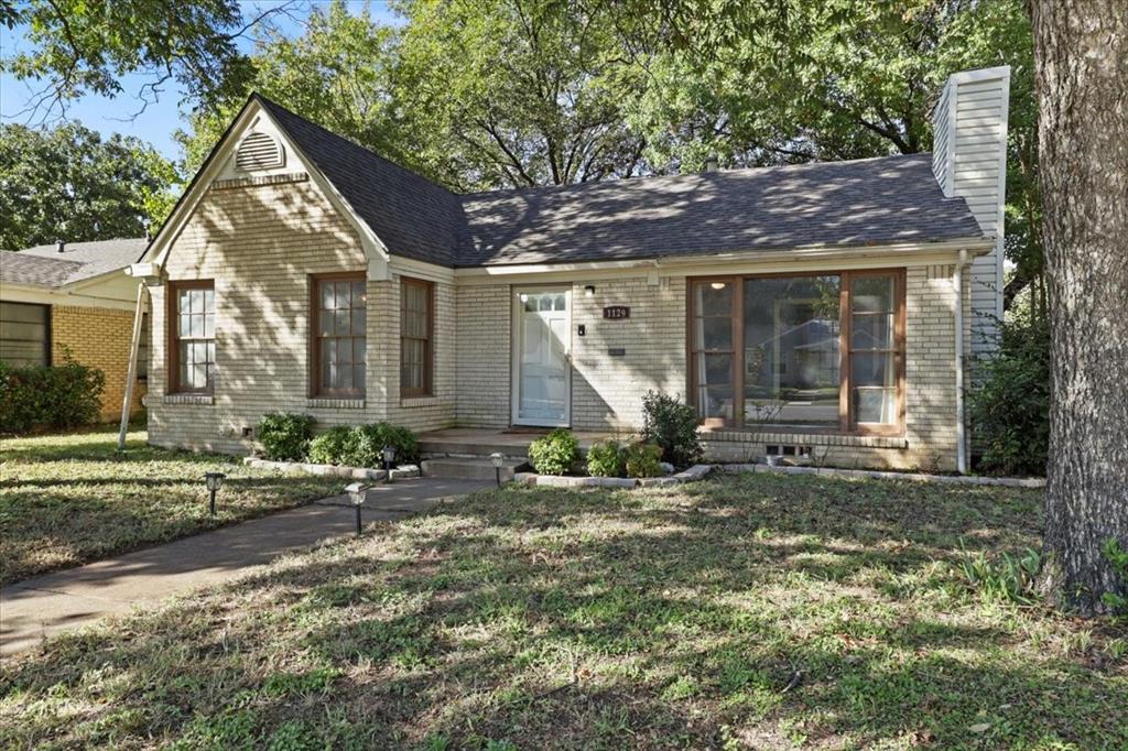 1129 North Riverside Drive Fort Worth, TX 76111 - Photo 5 of 29 a view of a house with backyard and garden