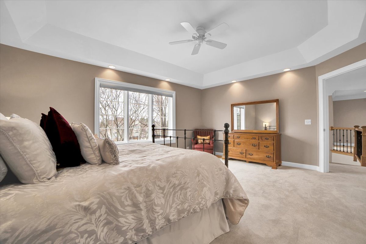 7N395 Ridge Line Road St. Charles, IL 60175 - Photo 18 of 40 a bedroom with a large bed and a tv