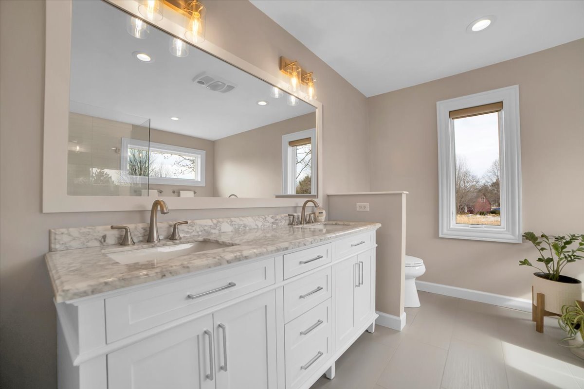 7N395 Ridge Line Road St. Charles, IL 60175 - Photo 19 of 40 a bathroom with a granite countertop sink mirror and a bathtub
