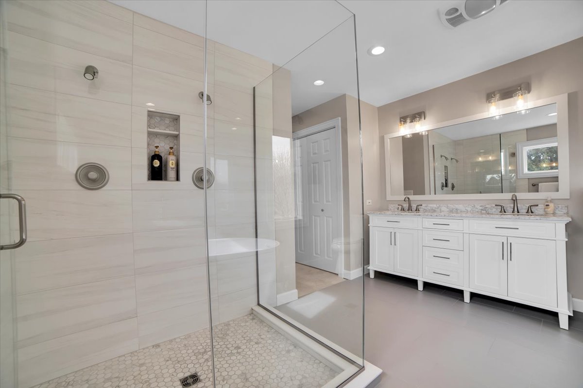 7N395 Ridge Line Road St. Charles, IL 60175 - Photo 21 of 40 a bathroom with a double vanity sink mirror and shower
