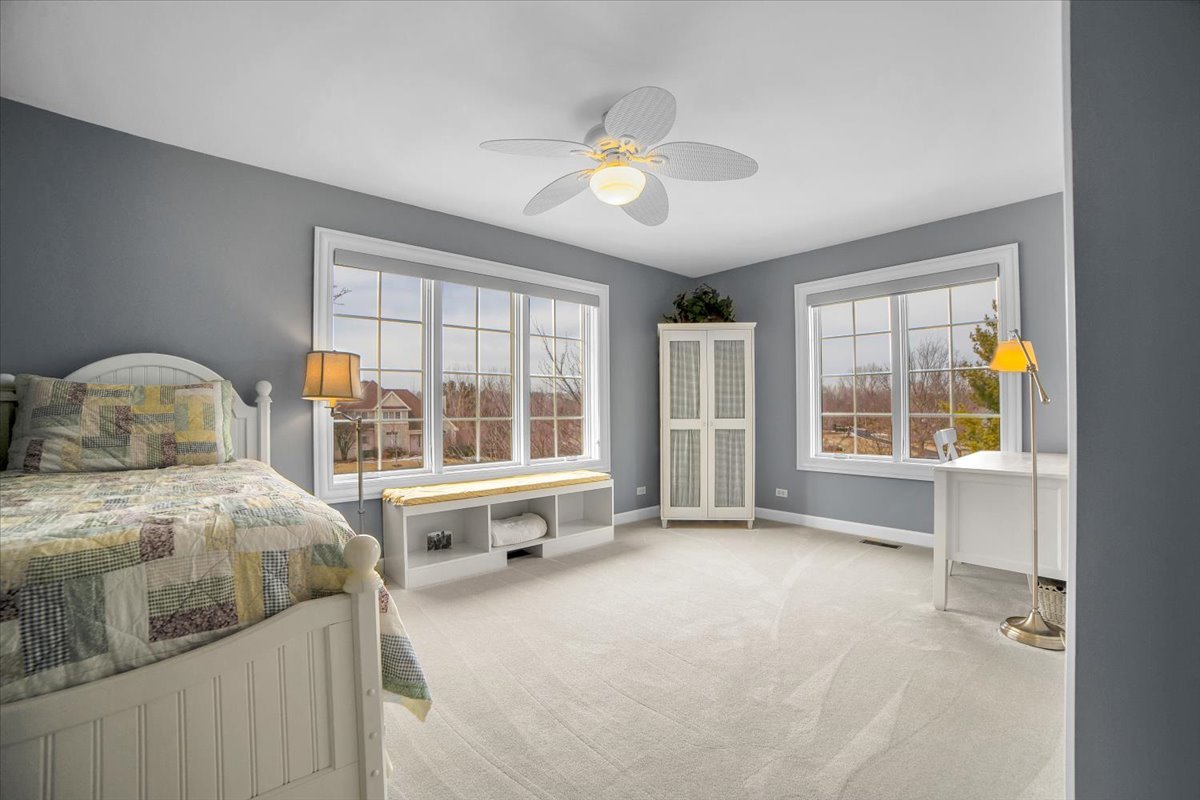 7N395 Ridge Line Road St. Charles, IL 60175 - Photo 33 of 40 a spacious bedroom with a bed and a large window
