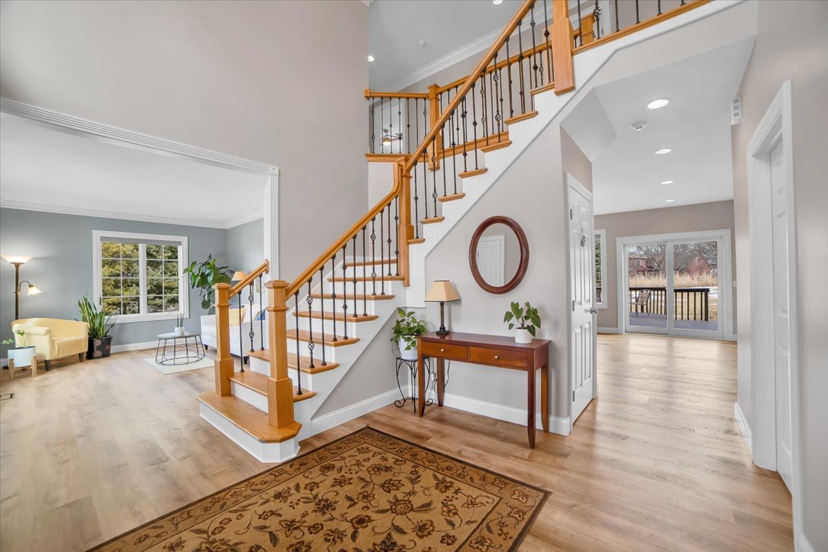 7N395 Ridge Line Road St. Charles, IL 60175 - Photo 5 of 40 a view of staircase with furniture and a chandelier