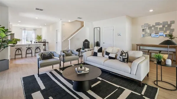 a living room with furniture and a table
