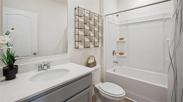 a bathroom with a sink a toilet and a bathtub