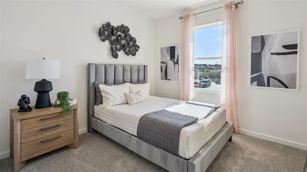 a bedroom with a bed and window