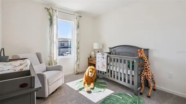 a bedroom with furniture and a window