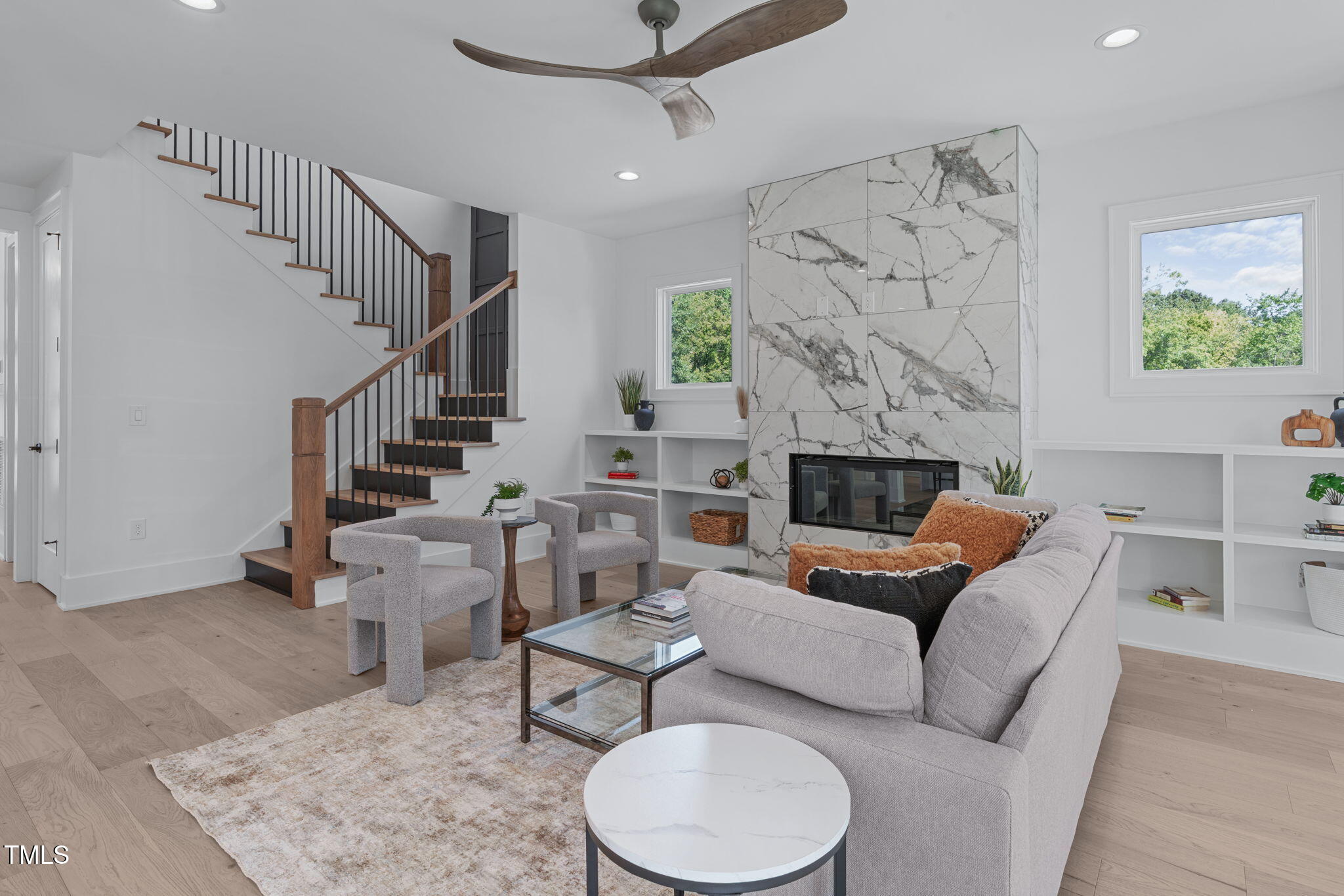 1016 Addison Place Raleigh, NC 27610 - Photo 11 of 50 a living room with furniture and a fireplace