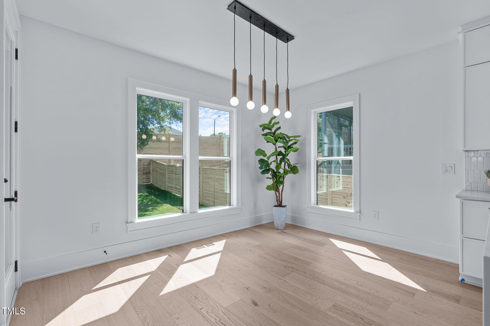 1016 Addison Place Raleigh, NC 27610 - Photo 17 of 50 an empty room with wooden floor and a window