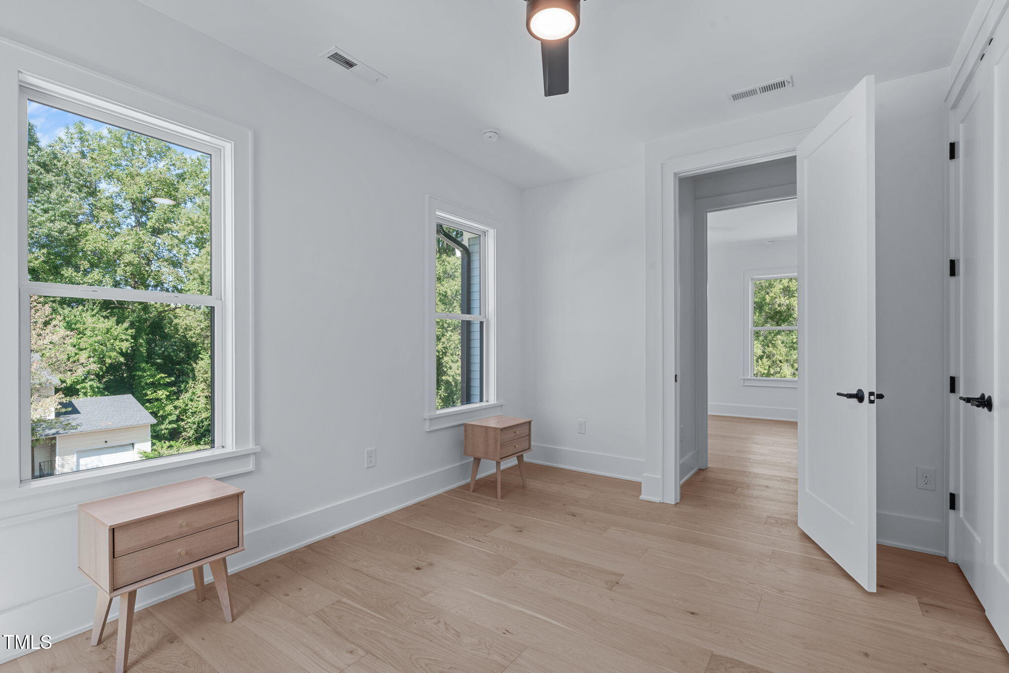 1016 Addison Place Raleigh, NC 27610 - Photo 29 of 50 an empty room with windows and closet