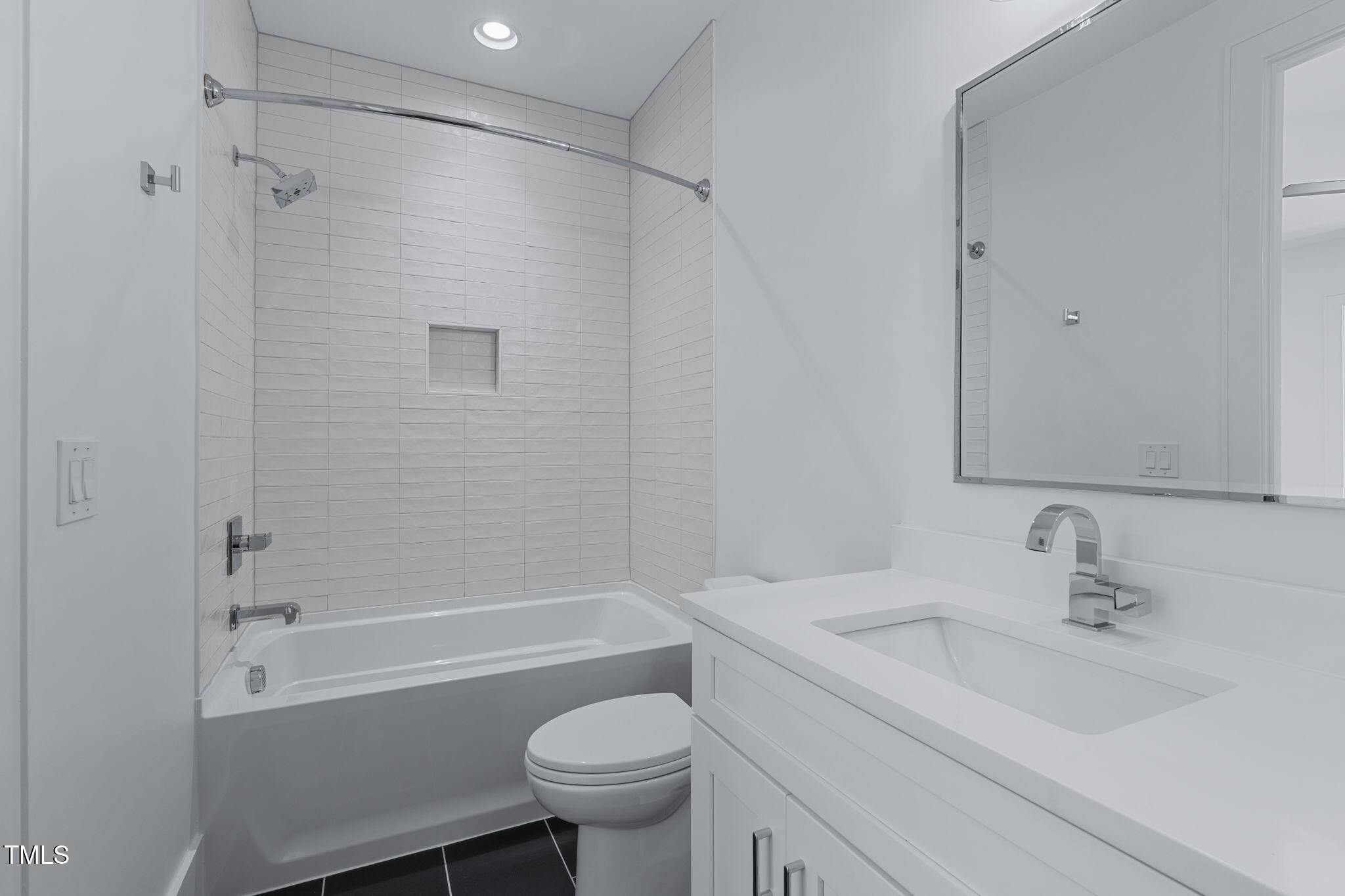 1016 Addison Place Raleigh, NC 27610 - Photo 31 of 50 a bathroom with a sink toilet and shower