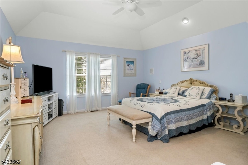15 Bracken Hill Road Hamburg, NJ 07419 - Photo 20 of 44 a bedroom with a bed and a flat screen tv