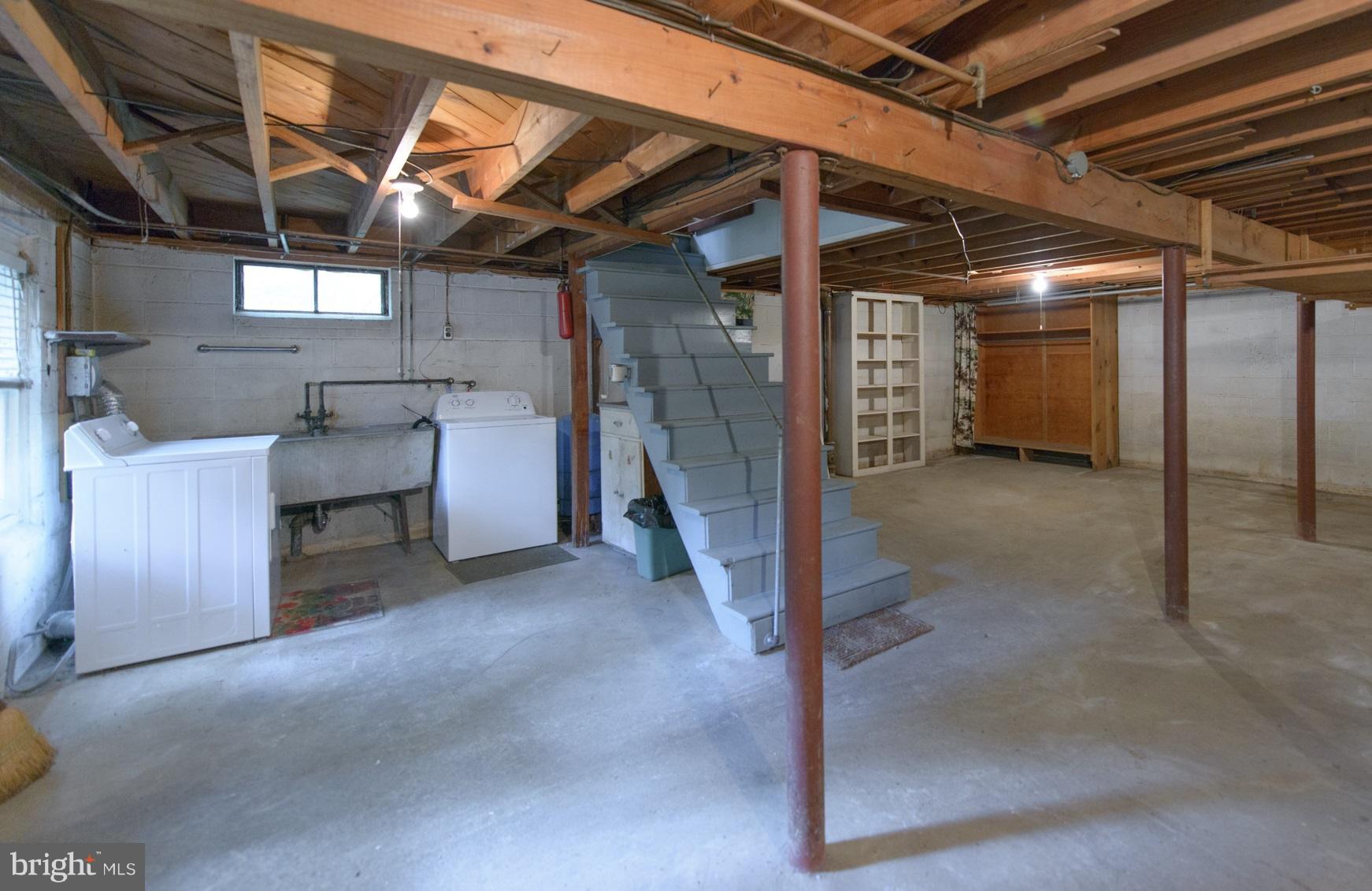 1937 Severn Grove Road Annapolis, MD 21401 - Photo 26 of 30 Large, unfinished basement with laundry area