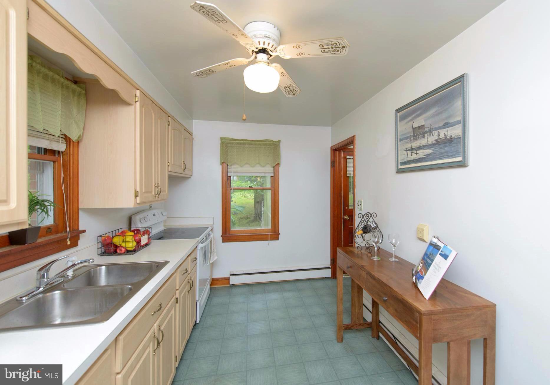 1937 Severn Grove Road Annapolis, MD 21401 - Photo 4 of 30 Galley kitchen adjacent to screened-in porch