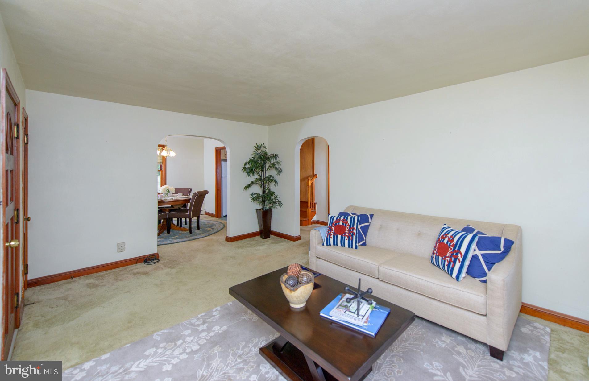 1937 Severn Grove Road Annapolis, MD 21401 - Photo 9 of 30 Living room, arched doorways, wood under carpet