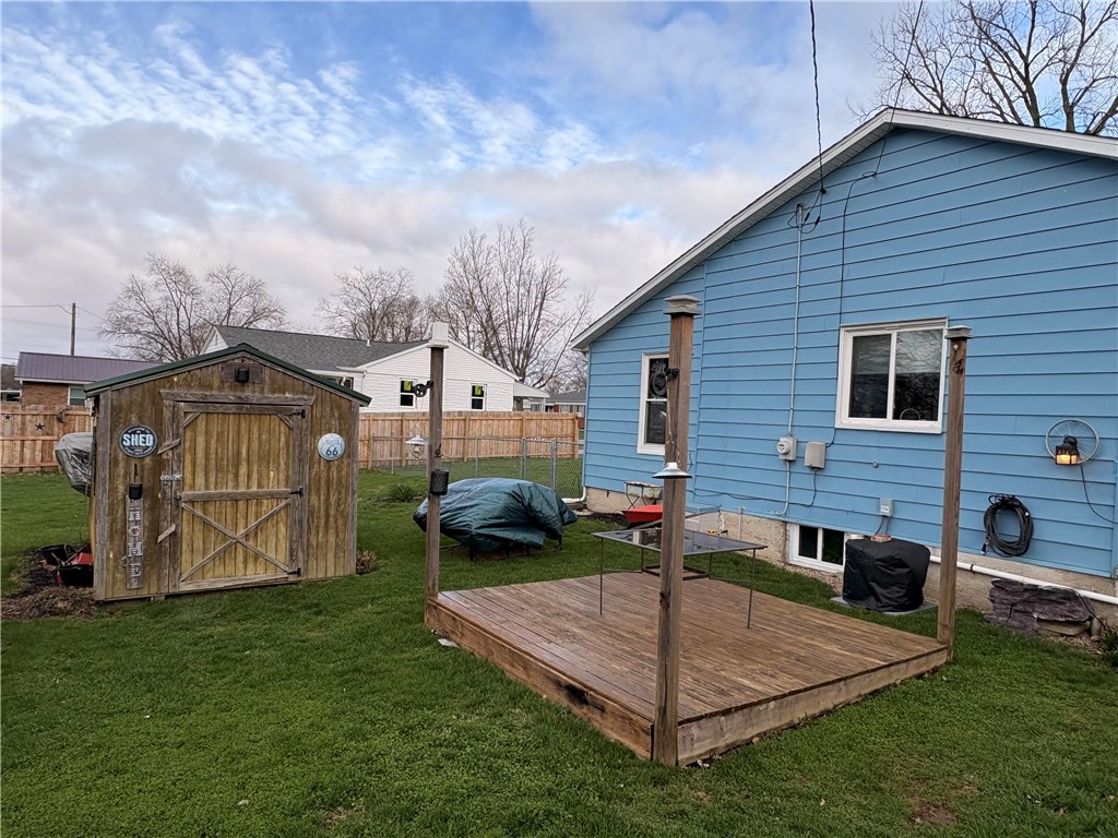 321 Liberty Street Eaton, OH 45320 - Photo 5 of 34 Enjoy outdoor living with a private yard featuring a deck and convenient storage shed.