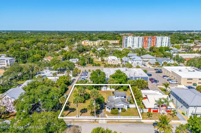 an aerial view of houses and roads