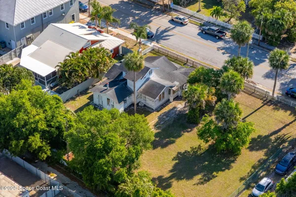 an aerial view of residential houses with outdoor space