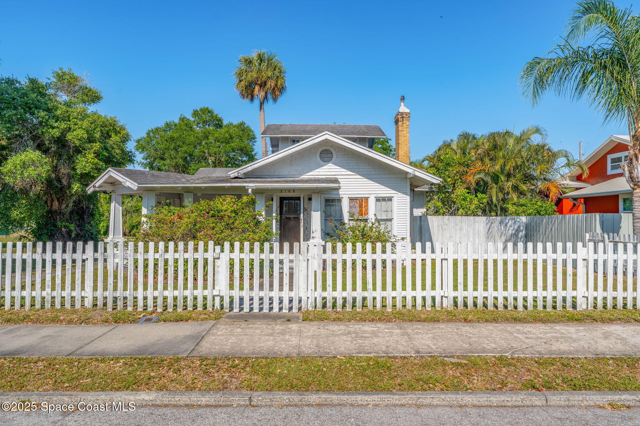 2106 Vernon Place Melbourne, FL 32901 - Photo 3 of 48 a front view of a house with a garden and plants