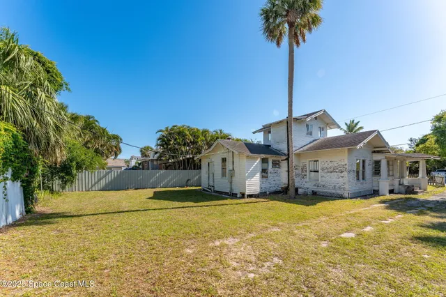 a view of a swimming pool with an outdoor space and seating area