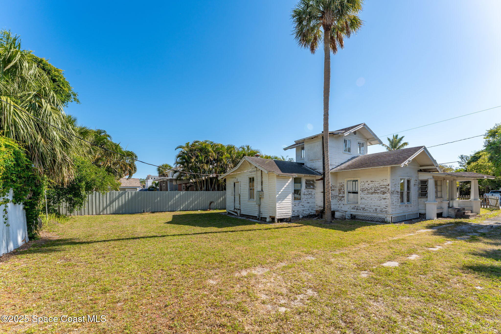 2106 Vernon Place Melbourne, FL 32901 - Photo 40 of 48 a front view of a house with a yard