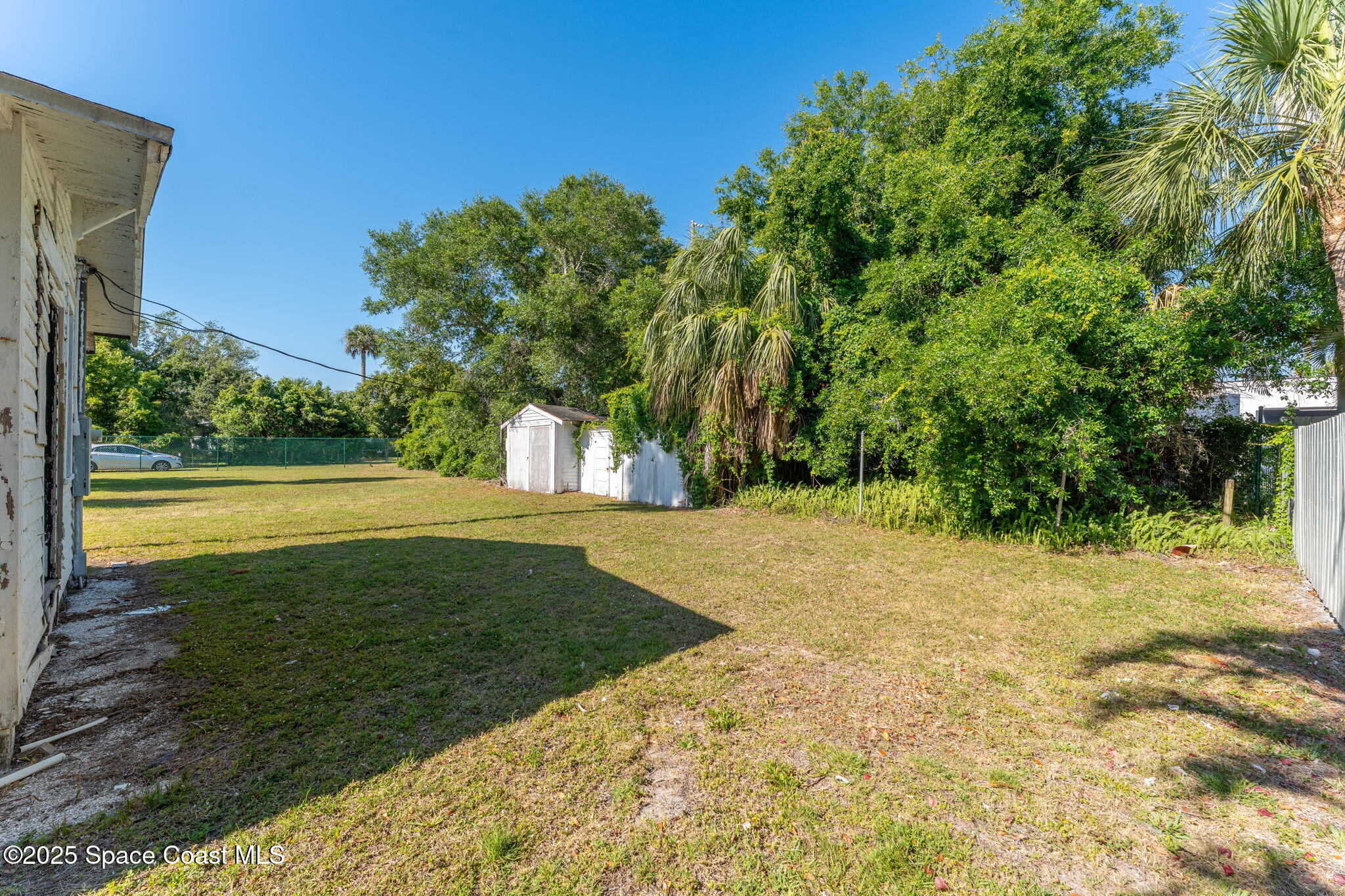 2106 Vernon Place Melbourne, FL 32901 - Photo 42 of 48 a view of a big yard with large trees