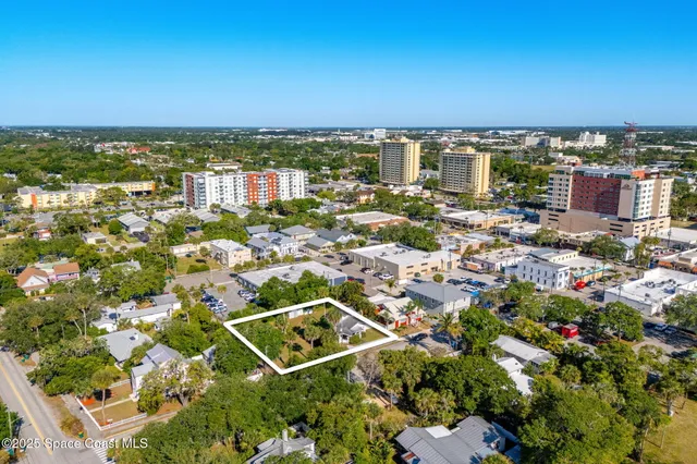 an aerial view of multiple house with outdoor space