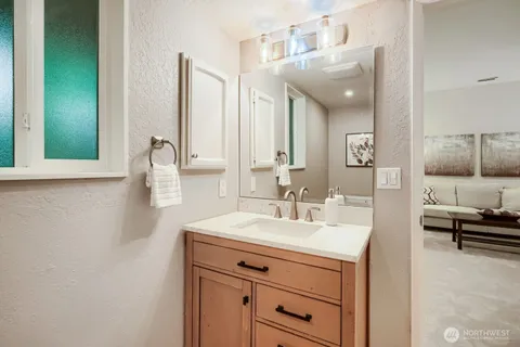 a bathroom with a sink and a mirror