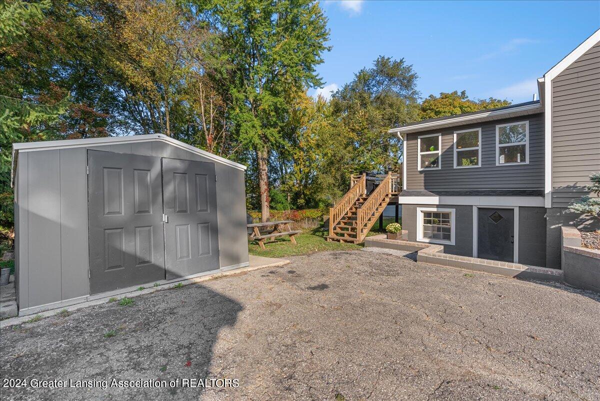 919 Maycroft Road Lansing, MI 48917 - Photo 37 of 58 Shed and Side Entrance