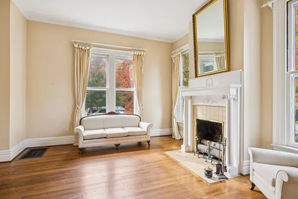a view of an entryway with wooden floor