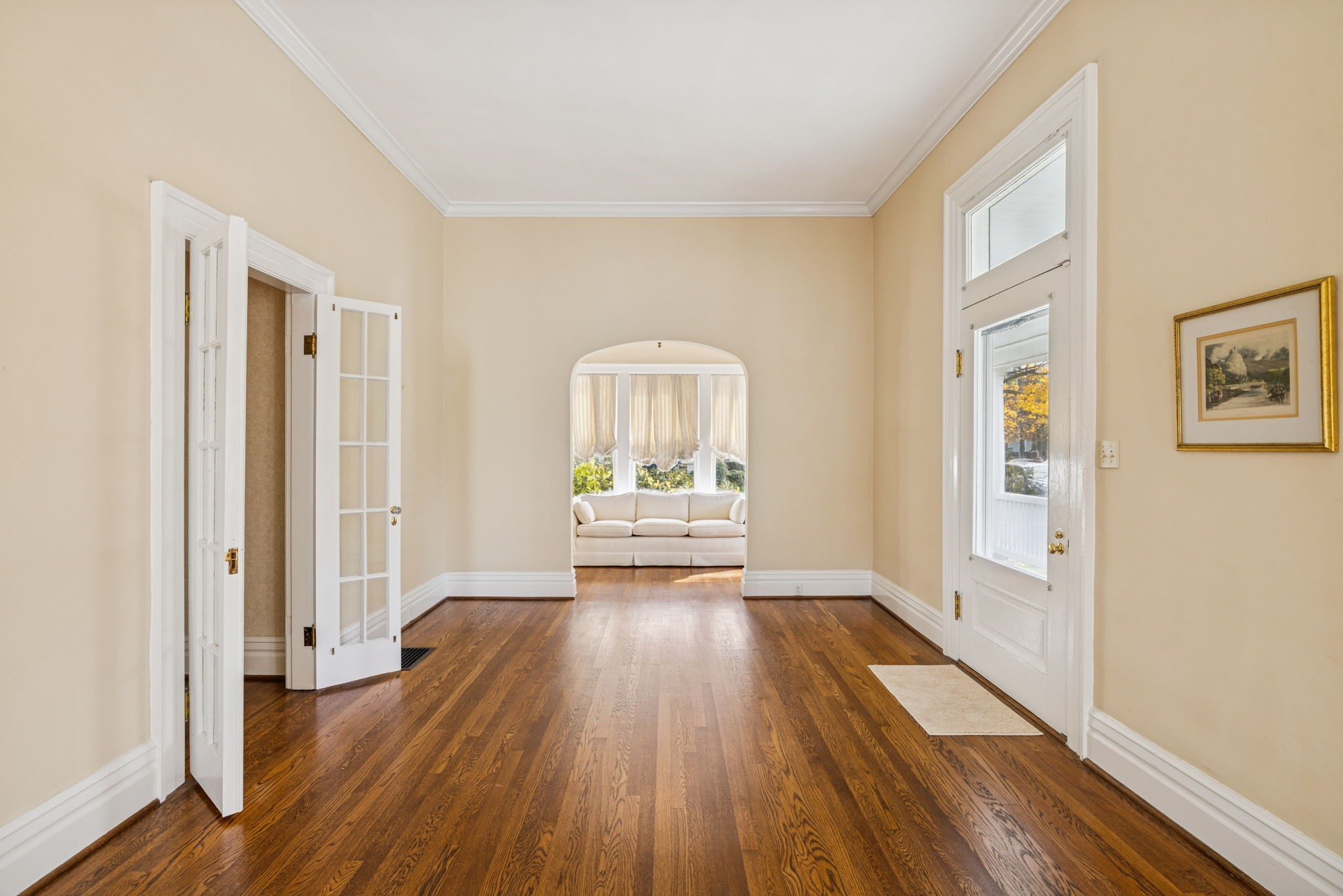 215 4th Avenue South Franklin, TN 37064 - Photo 21 of 86 a view of a hallway with wooden floor and a living room