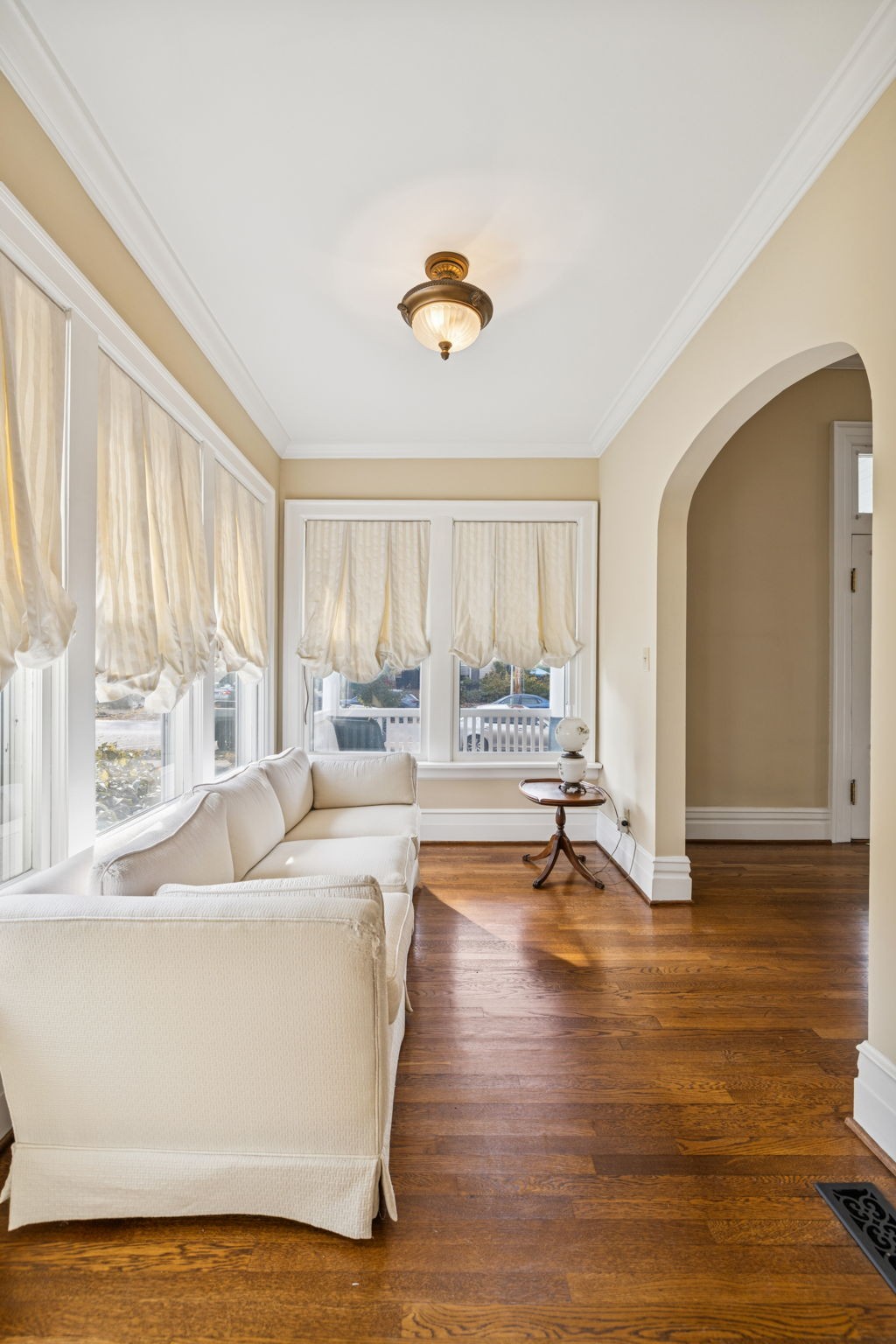 215 4th Avenue South Franklin, TN 37064 - Photo 26 of 86 a living room with couches and a dining table with wooden floor