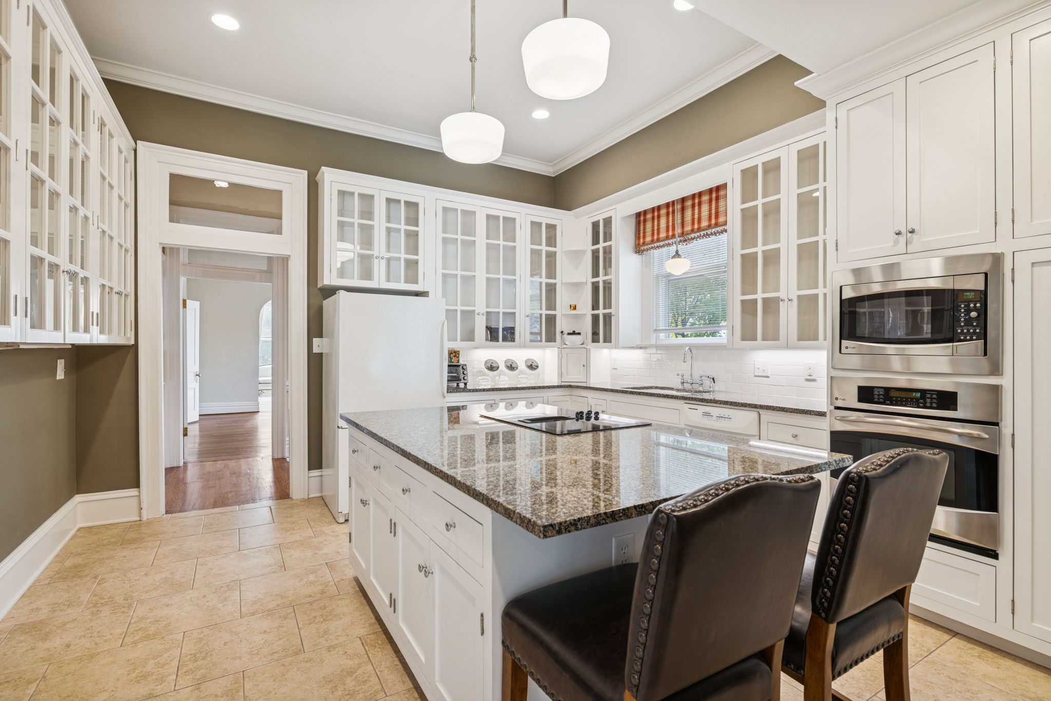 215 4th Avenue South Franklin, TN 37064 - Photo 45 of 86 a kitchen with stainless steel appliances granite countertop a stove and a sink
